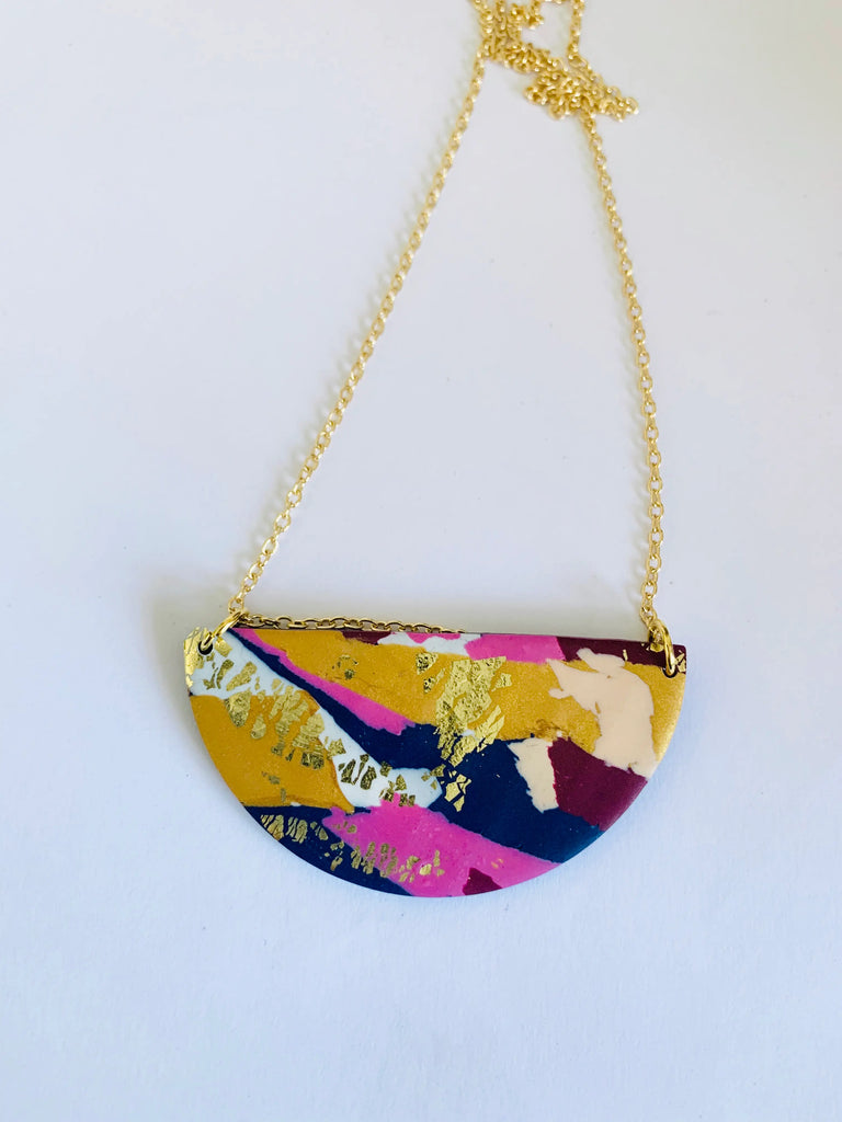 Handmade polymer clay necklace with touches of gold. No two pieces are ever exactly the same as they are all cut from a large designed piece of clay. Fixtures: 22ct gold-plated brass chain.