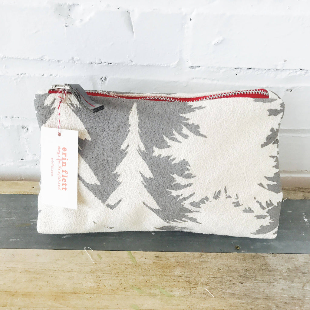 This hand-printed makeup bag is made of 100% bark cloth and produced from start to finish by Erin Flett in Maine. Measures 9 X 7 inches and features an industrial brass zipper with a recycled leather tab and brass bell pull gusset bottom. Care instructions: machine wash cold and dry flat.