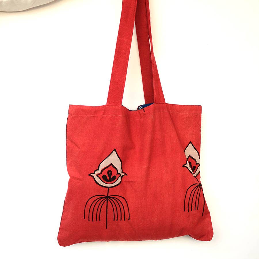 Avatar - Reversible Bag in blue, white, black, and coral / red. By Ichcha, block printed in India