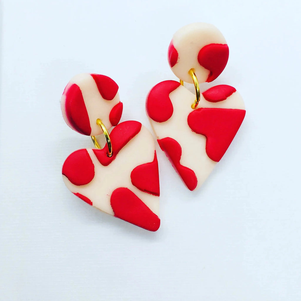 These gorgeous pale pink and red colored, drop polymer clay earrings are perfect for when you just need a little love. Silver-plated, nickel-free findings. Length measures 4 cm, width is 3 cm, and drop is 3 cm.