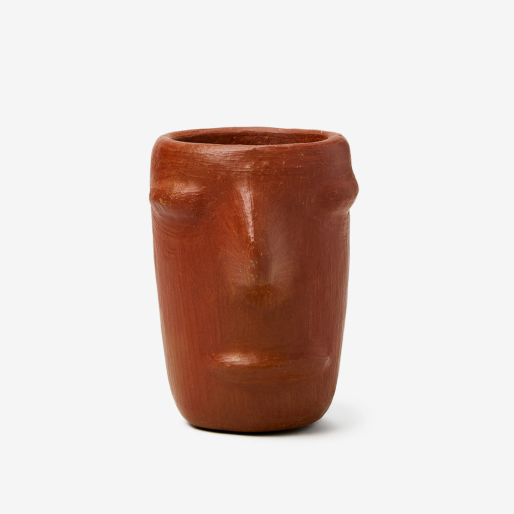 Extremely rare and hard to obtain, these artisan ornamental Zapotec shot glasses are handmade in a remote village outside Oaxaca, Mexico. From red clay with an unglazed finish, they come in a four piece set. They are inspired by the rough beauty of the san marcos pottery tradition and are great for drinking mezcal. These shot glasses will take you back to a much simpler time. The villagers only make a certain amount per year, making these pieces truly incredible.