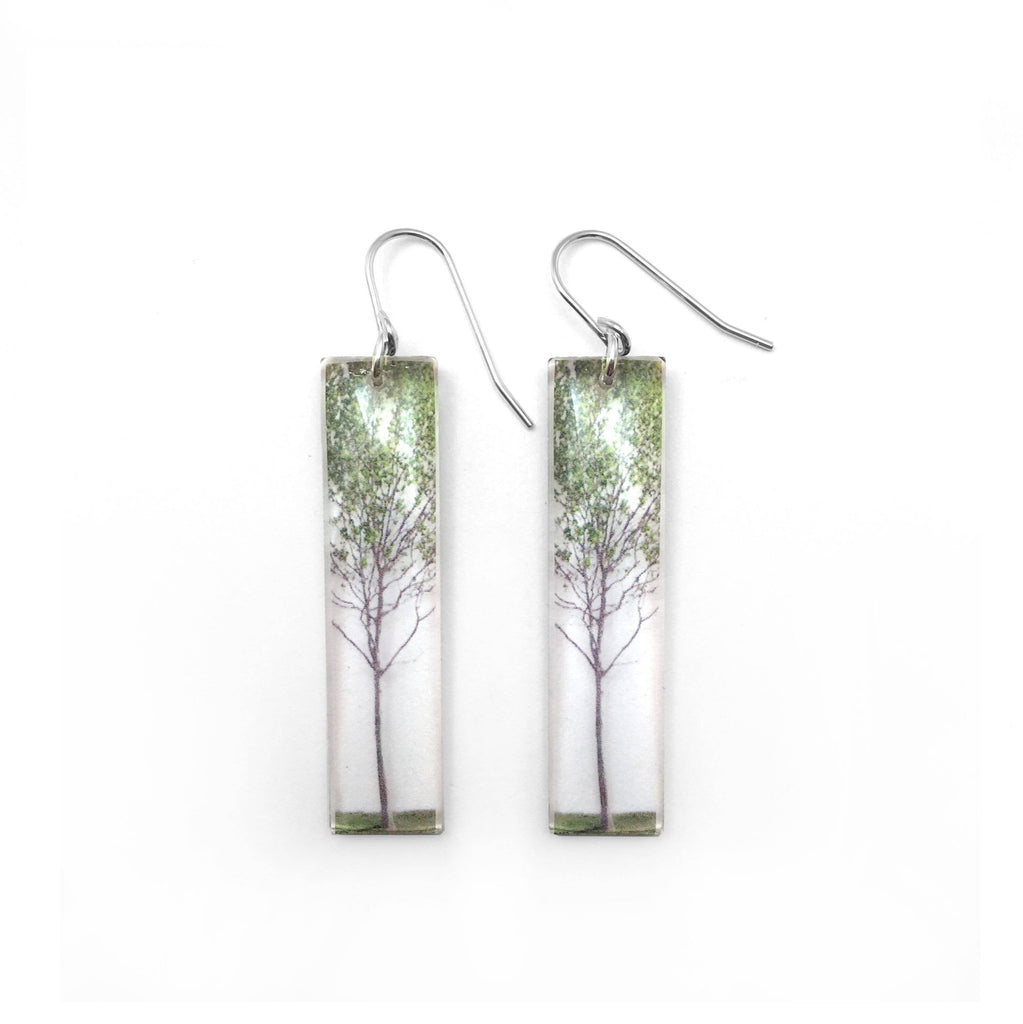 earrings with photo of a tree with green leaves set in acrylic and on sterling silver ear wire