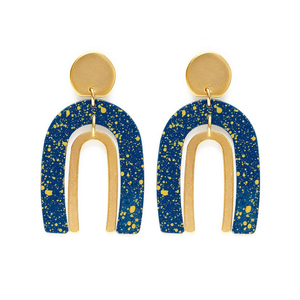 Drop earrings inspired by the Arches and starry sky of Moab, Utah. Surgical steel ear wires in blue and gold. Made by Amano Studio.
